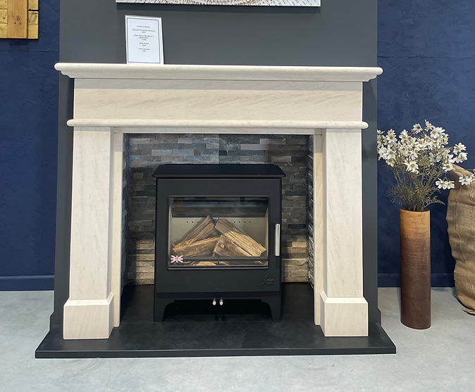 Gas fire inset installation with decorative stone surround in Southwest England