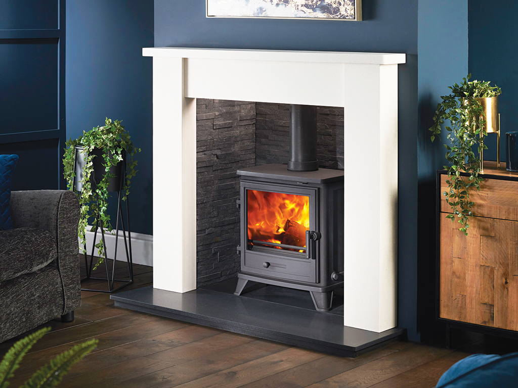Classic fire surround framing a multi-fuel stove in a Cornwall residence