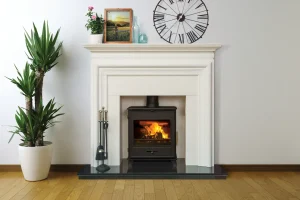Pevex Bucklesham black wood burning stove with white fireplace surround in Cornwall living room roomset