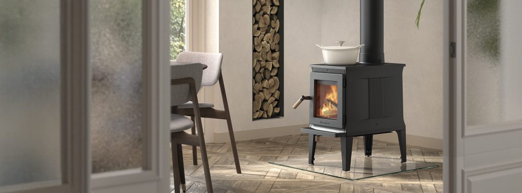 Multi-fuel stove with glass door showcasing flames in Cornwall living space
